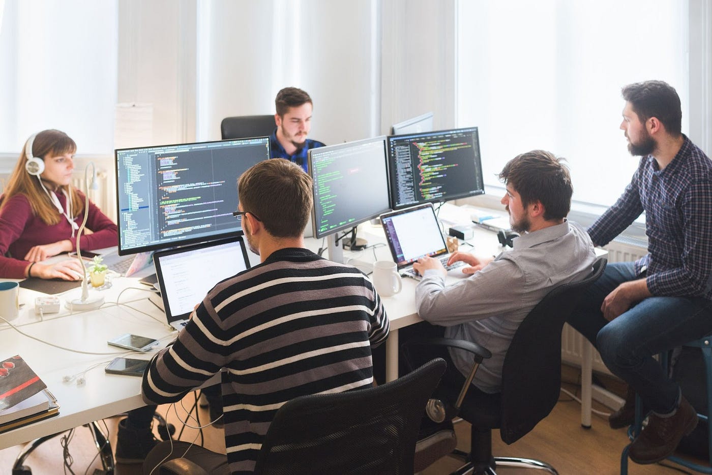 Software development team collaborating on custom solutions